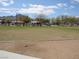 Green space and trees in a community, with homes in the background at 1072 Pennyfeather Rd, Henderson, NV 89015