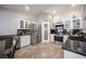 Well-appointed kitchen featuring stainless appliances, white cabinetry, and tile flooring at 1072 Pennyfeather Rd, Henderson, NV 89015