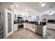 Modern kitchen featuring stainless steel appliances, a pantry, and access to the Gathering room at 1072 Pennyfeather Rd, Henderson, NV 89015