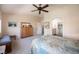 Spacious primary bedroom with dresser, ensuite bathroom, and closet at 1072 Pennyfeather Rd, Henderson, NV 89015
