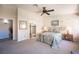 Primary bedroom featuring an en-suite bathroom and walk-in closet at 1072 Pennyfeather Rd, Henderson, NV 89015