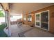 Covered patio with outdoor seating and desert landscaping at 1072 Pennyfeather Rd, Henderson, NV 89015