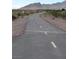View of paved walking path with desert landscape and mountains in the background at 1072 Pennyfeather Rd, Henderson, NV 89015