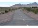 View of paved walking path with desert landscape and mountains in the background at 1072 Pennyfeather Rd, Henderson, NV 89015