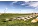 Open sports field with soccer goals and stadium-style seating at 1072 Pennyfeather Rd, Henderson, NV 89015