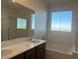 Bathroom featuring double sinks, granite countertops, a shower, and a soaking tub at 12434 Parkscene Pl, Las Vegas, NV 89138
