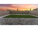 This backyard has a green grass patch with block wall and a brick patio, perfect for entertaining friends at 12457 Sunset Sage Ave, Las Vegas, NV 89138