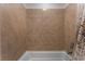 Tiled bathtub and shower combination, offering a clean and modern design at 12457 Sunset Sage Ave, Las Vegas, NV 89138