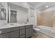 Bathroom features a double sink vanity with modern fixtures, and a tiled shower-over-tub combination at 12457 Sunset Sage Ave, Las Vegas, NV 89138