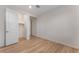 Bright bedroom featuring wood floors and a walk-in closet with open white door at 12457 Sunset Sage Ave, Las Vegas, NV 89138