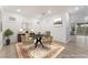 Virtually staged dining room with table, six chairs, and modern decorations at 12457 Sunset Sage Ave, Las Vegas, NV 89138