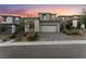 Beautiful two-story home featuring stone accents and a spacious two-car garage and a beautiful brick driveway at 12457 Sunset Sage Ave, Las Vegas, NV 89138