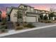 Beautiful two-story home featuring stone accents and a spacious two-car garage and a beautiful brick driveway at 12457 Sunset Sage Ave, Las Vegas, NV 89138