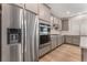An open kitchen with stainless steel appliances and lots of cabinet space at 12457 Sunset Sage Ave, Las Vegas, NV 89138