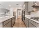 Bright kitchen features stainless appliances, an island, and white countertops at 12457 Sunset Sage Ave, Las Vegas, NV 89138