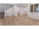 Bright Living room with wood flooring, stairway, and natural light at 12457 Sunset Sage Ave, Las Vegas, NV 89138