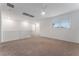 Carpeted loft area with a ceiling fan and window for natural light at 12457 Sunset Sage Ave, Las Vegas, NV 89138