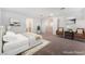 Staged bedroom with neutral walls, a bed, and two accent chairs, enhancing the room's appeal at 12457 Sunset Sage Ave, Las Vegas, NV 89138