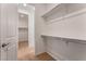 Spacious walk-in closet with ample shelving and storage options, providing convenient organization at 12457 Sunset Sage Ave, Las Vegas, NV 89138