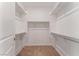 Large walk-in closet with abundant storage, including white shelves and chrome rods at 12457 Sunset Sage Ave, Las Vegas, NV 89138