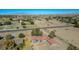 Aerial view showcases a home with a red tile roof, desert landscape and distant mountain views at 1967 N Moapa Valley Blvd, Logandale, NV 89021