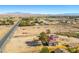 Expansive aerial view of a home with a red tile roof and scenic desert landscape and mountain view at 1967 N Moapa Valley Blvd, Logandale, NV 89021