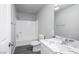 Clean bathroom with marble countertop, large mirror, bathtub, and shower at 1967 N Moapa Valley Blvd, Logandale, NV 89021