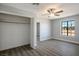 Cozy bedroom features a ceiling fan, a built in closet, and a window overlooking the outdoors at 1967 N Moapa Valley Blvd, Logandale, NV 89021