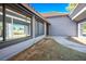 Exterior view showcasing large windows and access to a covered walkway, offering ample natural light and outdoor living space at 1967 N Moapa Valley Blvd, Logandale, NV 89021