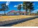 A single-story house with a red tile roof and large windows stands on a sprawling property with mature trees at 1967 N Moapa Valley Blvd, Logandale, NV 89021