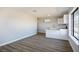 Open concept kitchen includes white cabinets, countertops, sink, and a large window for natural lighting at 1967 N Moapa Valley Blvd, Logandale, NV 89021