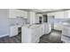 Modern kitchen featuring white cabinets, sleek countertops, and stainless steel appliances, creating a bright and functional space at 1967 N Moapa Valley Blvd, Logandale, NV 89021