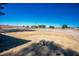 Expansive parcel of land showcasing a flat, open area with distant mountain views on a clear day at 1967 N Moapa Valley Blvd, Logandale, NV 89021