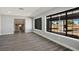 Spacious living room with large windows and a staircase leading to the second floor at 1967 N Moapa Valley Blvd, Logandale, NV 89021