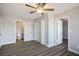Spacious main bedroom boasts a ceiling fan, and easy access to the bathroom and closet at 1967 N Moapa Valley Blvd, Logandale, NV 89021