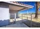 Cozy covered patio area with a small gate, ideal for outdoor relaxing and pet access at 1967 N Moapa Valley Blvd, Logandale, NV 89021