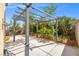 Landscaped backyard featuring a covered patio, mature landscaping, and concrete patio at 1988 Villa De Sol St, Las Vegas, NV 89156