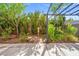 A cozy backyard featuring a patio, pergola with string lights, and mature landscaping at 1988 Villa De Sol St, Las Vegas, NV 89156
