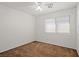 Bedroom featuring a ceiling fan, large window, and neutral carpeting at 1988 Villa De Sol St, Las Vegas, NV 89156
