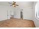 Spacious bedroom with plush carpeting, ceiling fan, and a large window at 1988 Villa De Sol St, Las Vegas, NV 89156