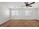 Bedroom featuring two windows, a ceiling fan, and neutral carpeting at 1988 Villa De Sol St, Las Vegas, NV 89156