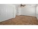 Bedroom featuring a ceiling fan, large window, closet, and neutral carpeting at 1988 Villa De Sol St, Las Vegas, NV 89156