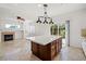 Bright kitchen features a large island, modern lighting, and a sliding glass door to the backyard at 1988 Villa De Sol St, Las Vegas, NV 89156