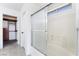 Bathroom featuring a shower and a view into the walk-in closet at 2211 Arborwood Way, Las Vegas, NV 89142