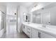 Well-lit bathroom with dual sinks and a large mirror at 2211 Arborwood Way, Las Vegas, NV 89142