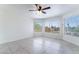 Spacious bedroom with tile flooring, three windows, and plenty of natural light at 2211 Arborwood Way, Las Vegas, NV 89142