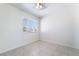 Bedroom with tile flooring, ceiling fan, and natural light from large windows at 2211 Arborwood Way, Las Vegas, NV 89142