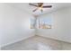 Bedroom with tile flooring, ceiling fan, and views from large windows at 2211 Arborwood Way, Las Vegas, NV 89142