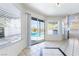 Bright dining area with sliding door access to the patio and swimming pool at 2211 Arborwood Way, Las Vegas, NV 89142