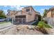 Charming two-story home with a two-car garage, low maintenance front yard, and desert landscaping at 2211 Arborwood Way, Las Vegas, NV 89142